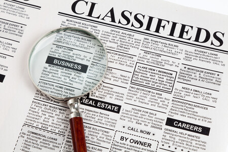 The CE21 Classifieds Ad Module, showing a magnifying glass over ads, which helps associations generate revenue by allowing members to sell products and services.